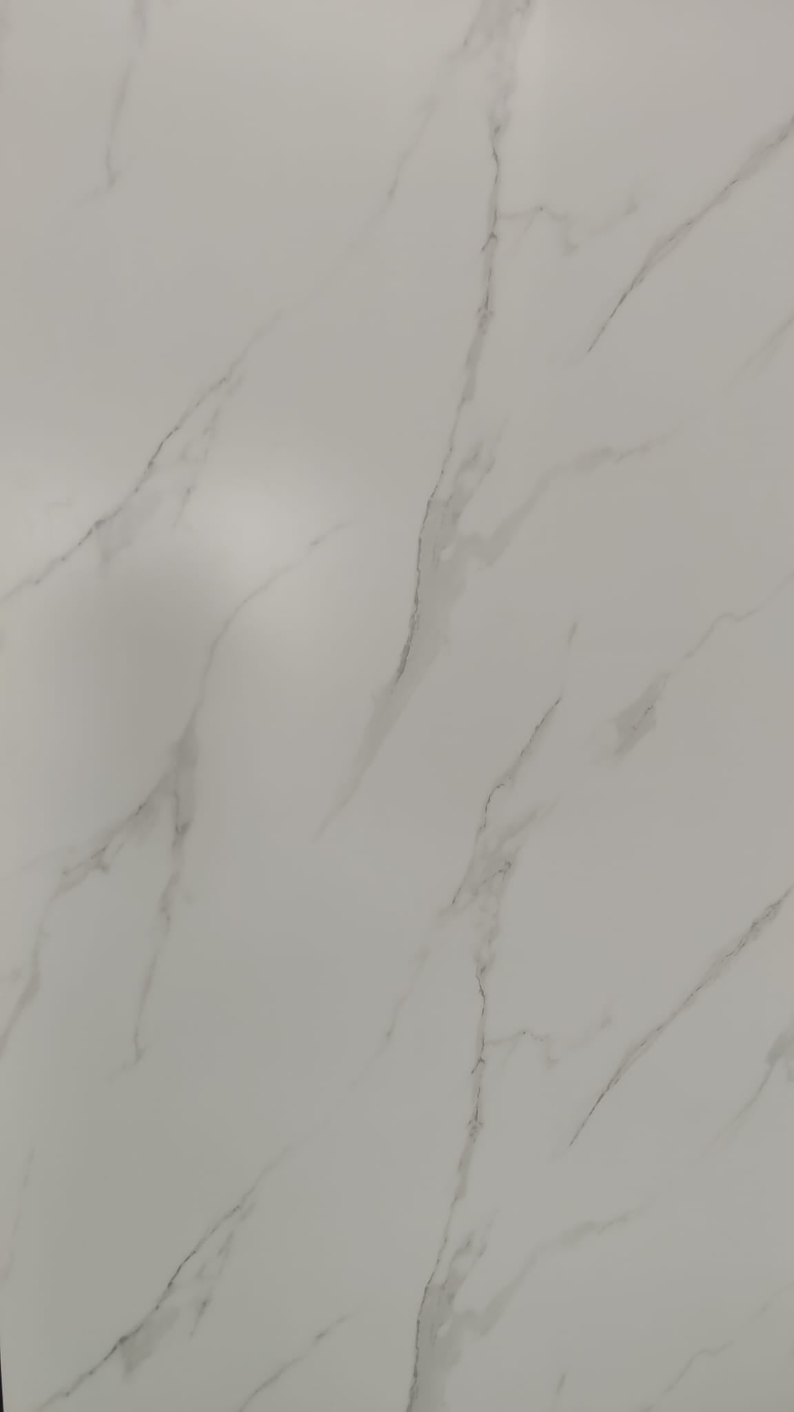 Luxury Carrara Silk white and grey marble effect wall panel in a bright Tenerife bathroom.