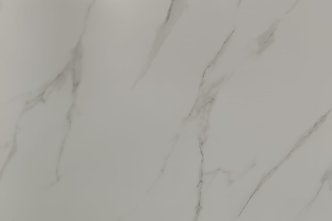 Close-up detail of the soft grey veining on the white background of the Carrara Silk panel.