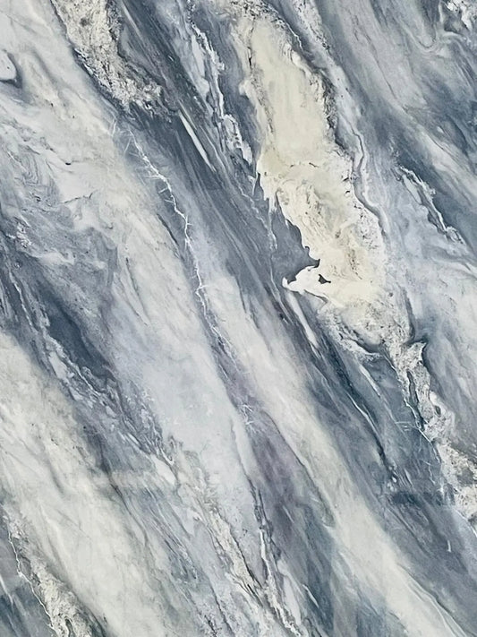 Luxury Midnight Lagoon glossy blue white grey smokey swirl polymer-stone wall panel in a modern Tenerife bathroom.