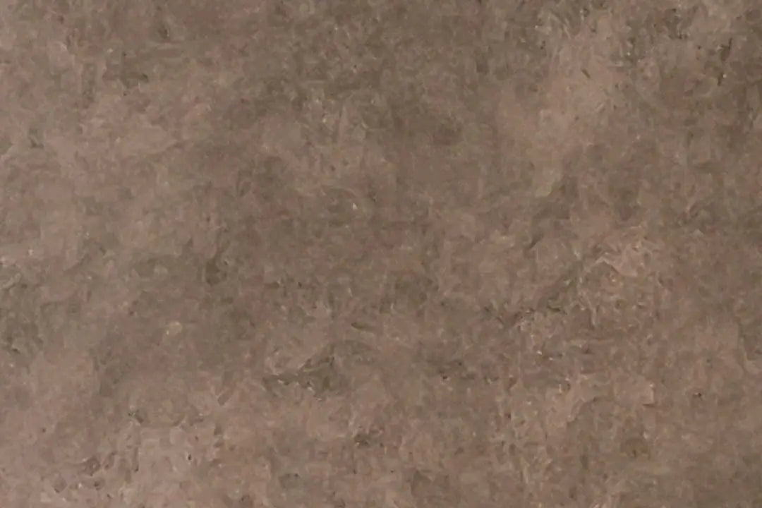 Close-up detail showing textured patina and warm bronze tones.

