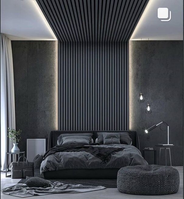 Professional installation of PVC Fluted wall panels in a Tenerife bedroom.